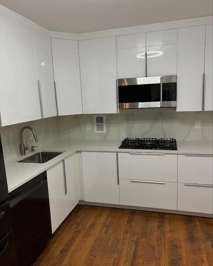 Restored kitchen with white cabinets after water damage in South Miami Heights